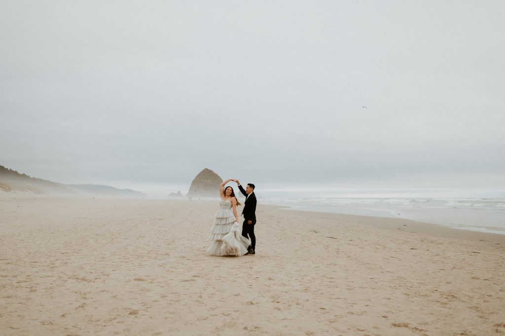 Kourtney and Sage dancing on the beach at Haystack rock in Cannon Beach, Oregon
