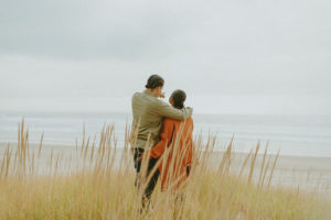 engaged couple on the Oregon coast