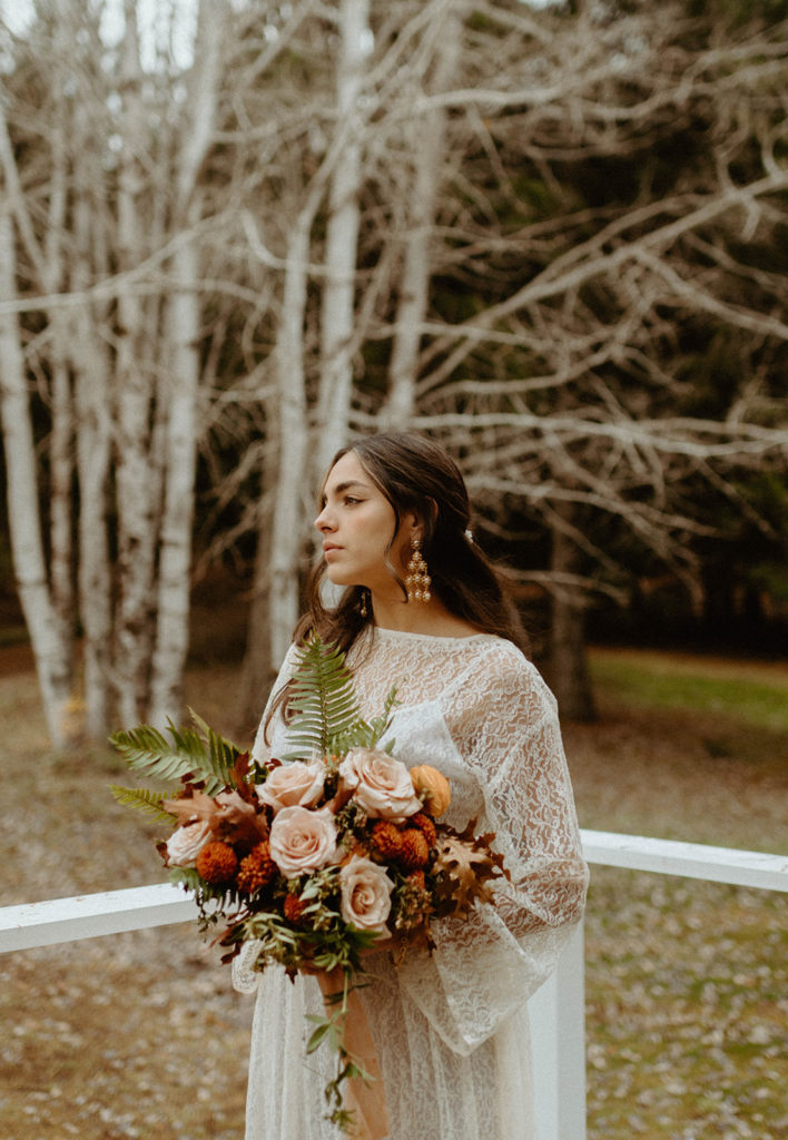 Fall bouquet with bride in lace wedding dress