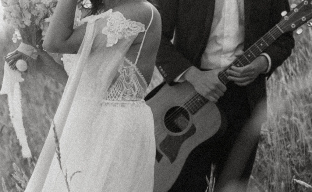 bride and groom with guitar