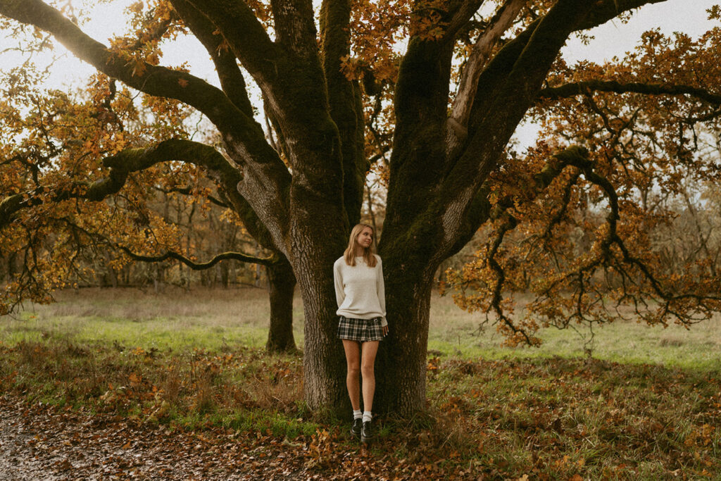 girl standing in front of tree in Oregon