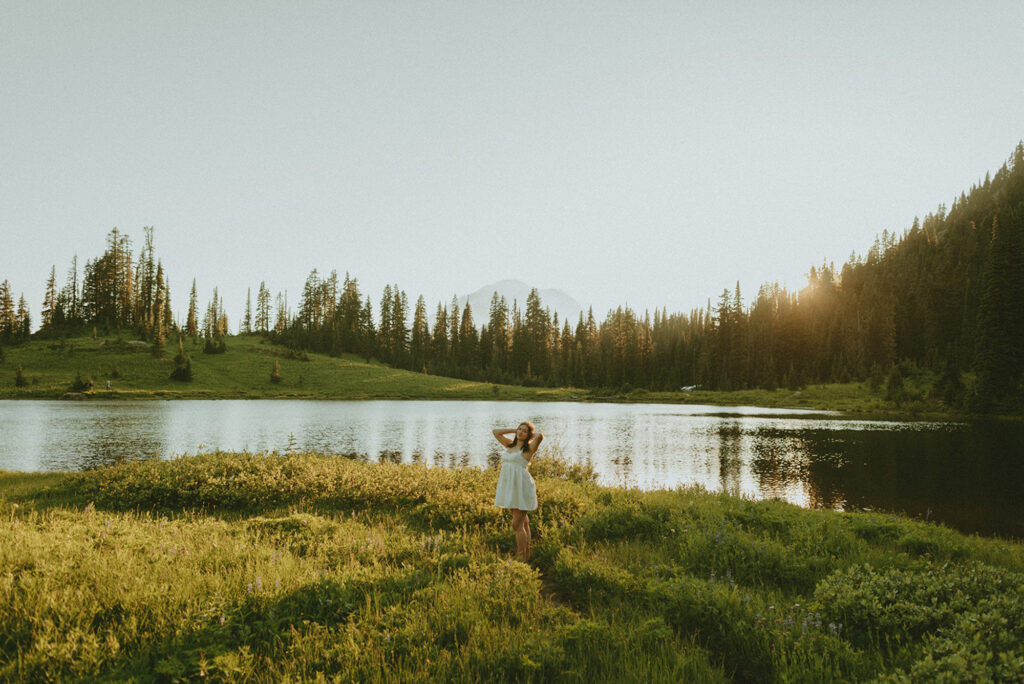 girl in white dress standing in lake area on the west coast