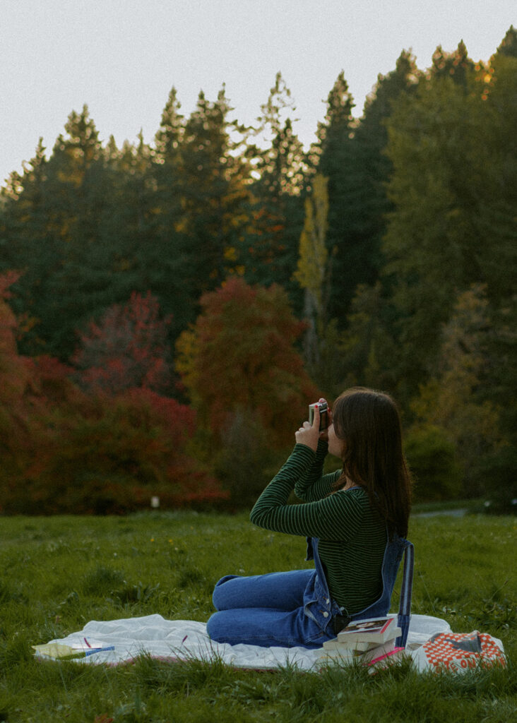 girl taking photos in park in Oregon
