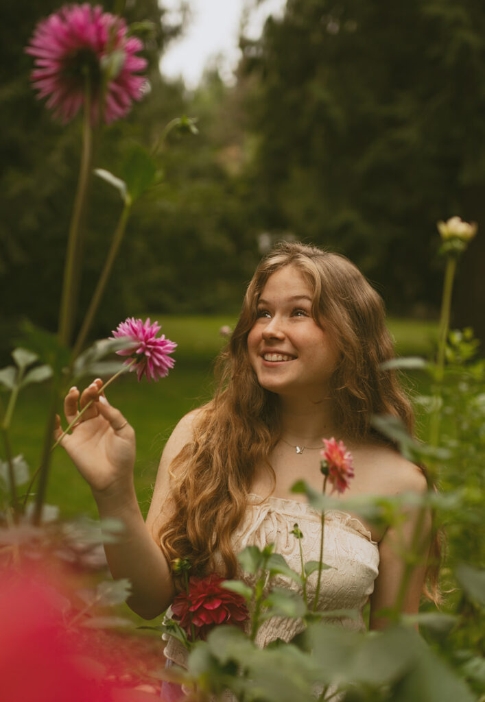 girl smiling amongst flowers 
