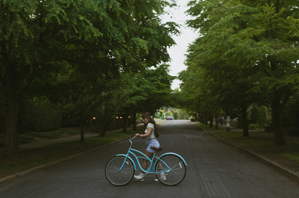 girl with blue bike at rose garden in Oregon