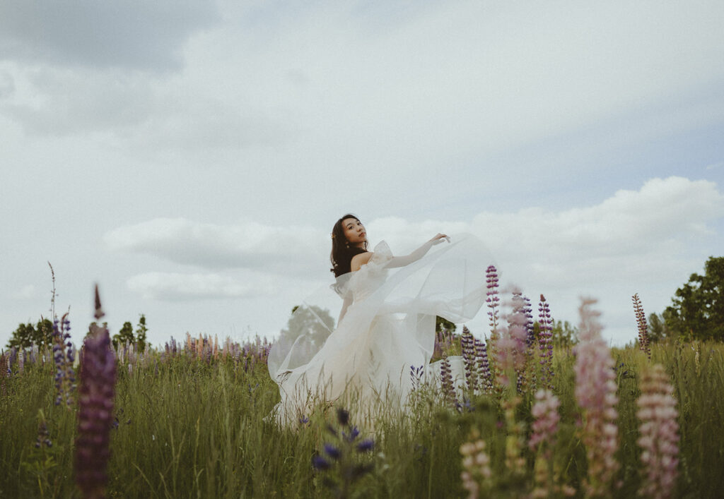 girl twirling in flower field in Oregon