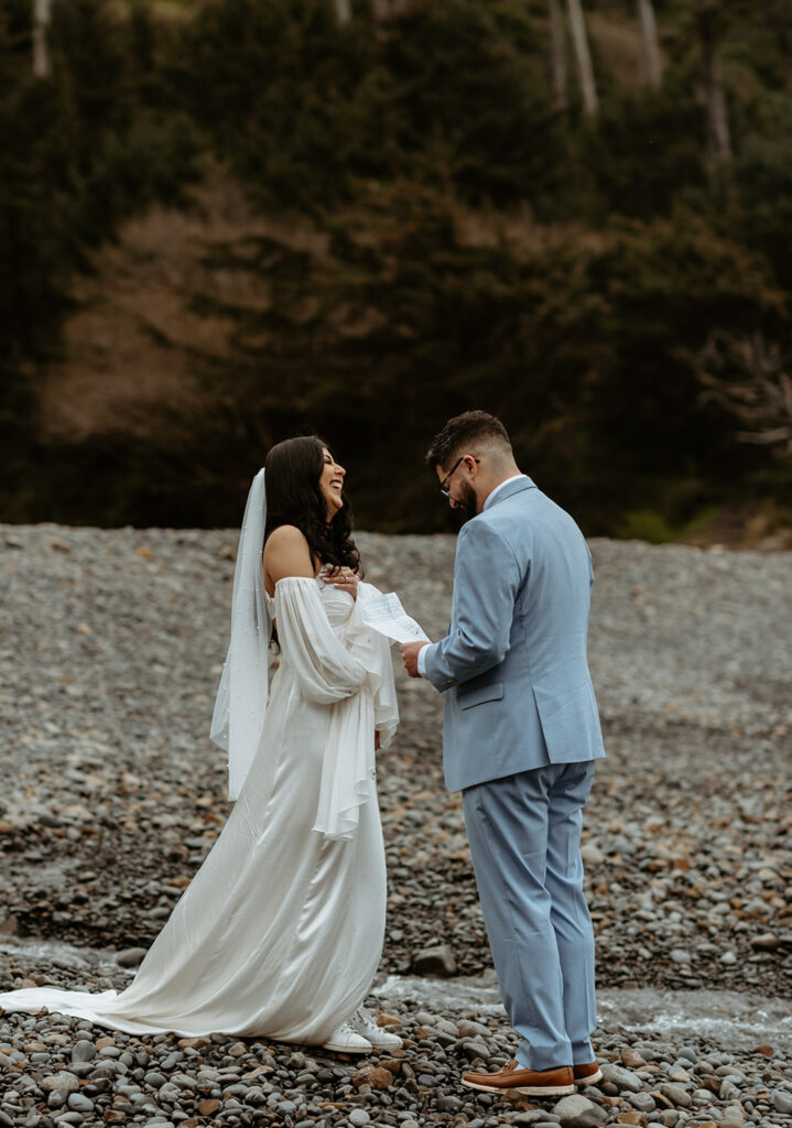 bride and groom exchanging vows on rocky beach at Ecola State Park