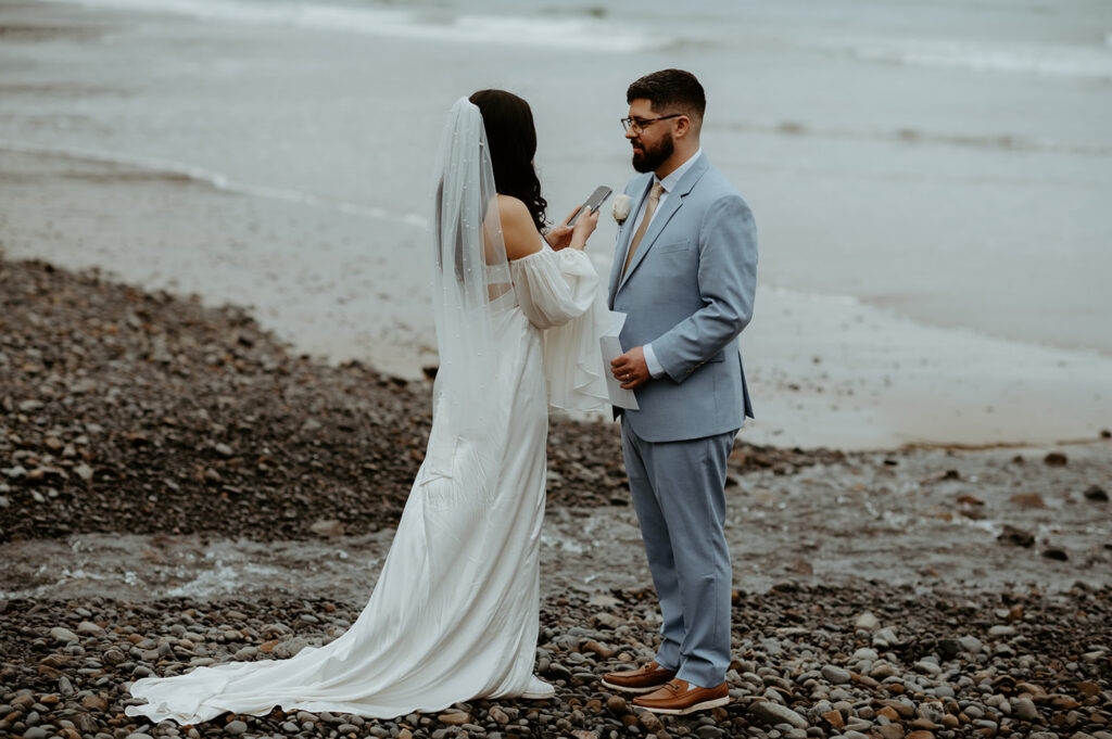couple exchanging vows at Ecola State Park elopement