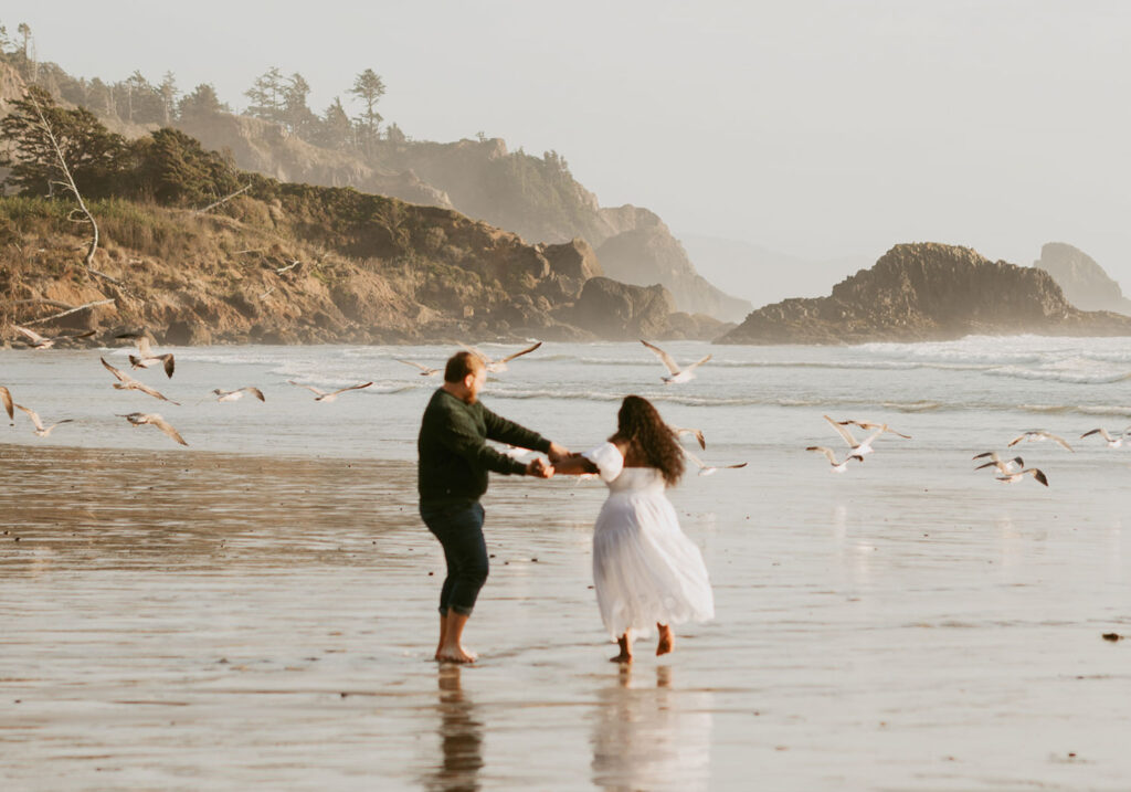 Couple dancing on the Oregon Coast beach