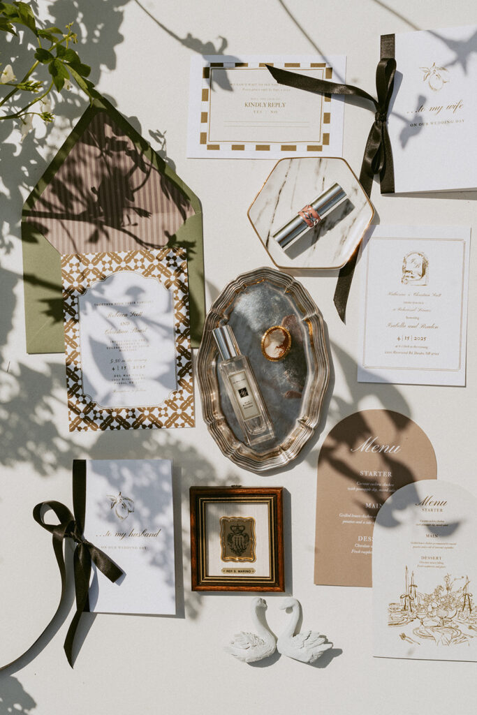 A table topped with a variety of wedding invitations and cards.