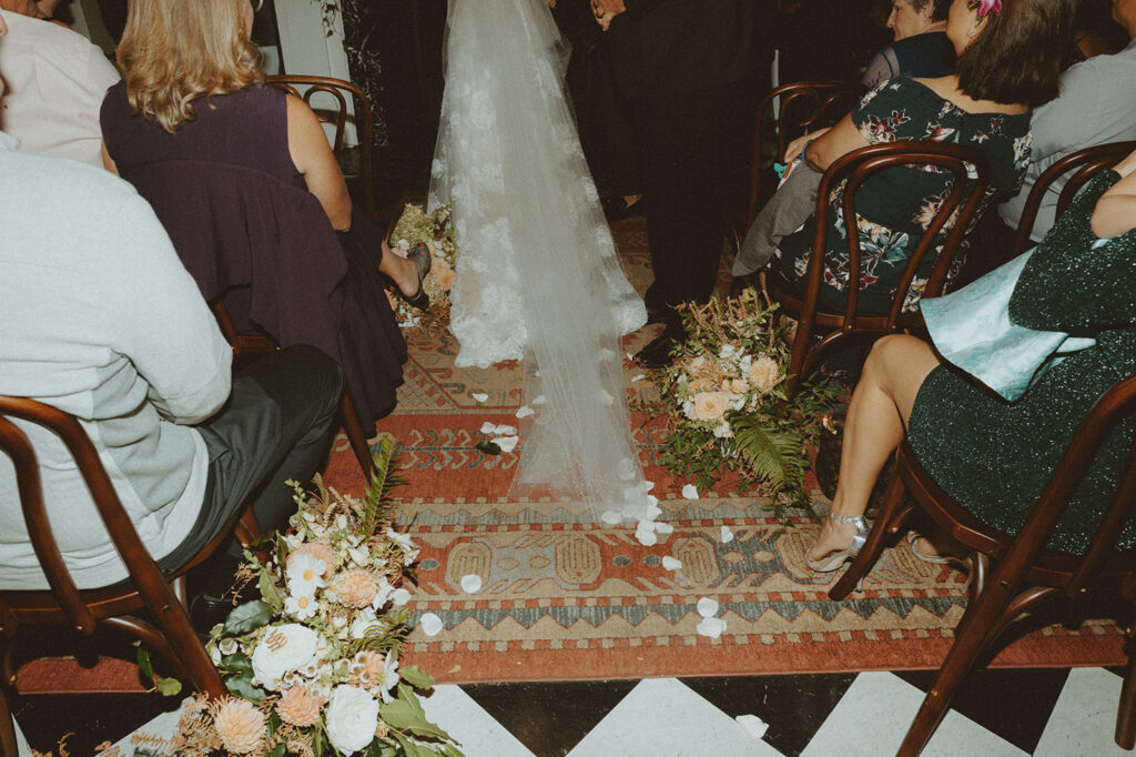 Bride walking down the aisle at their wedding ceremony.