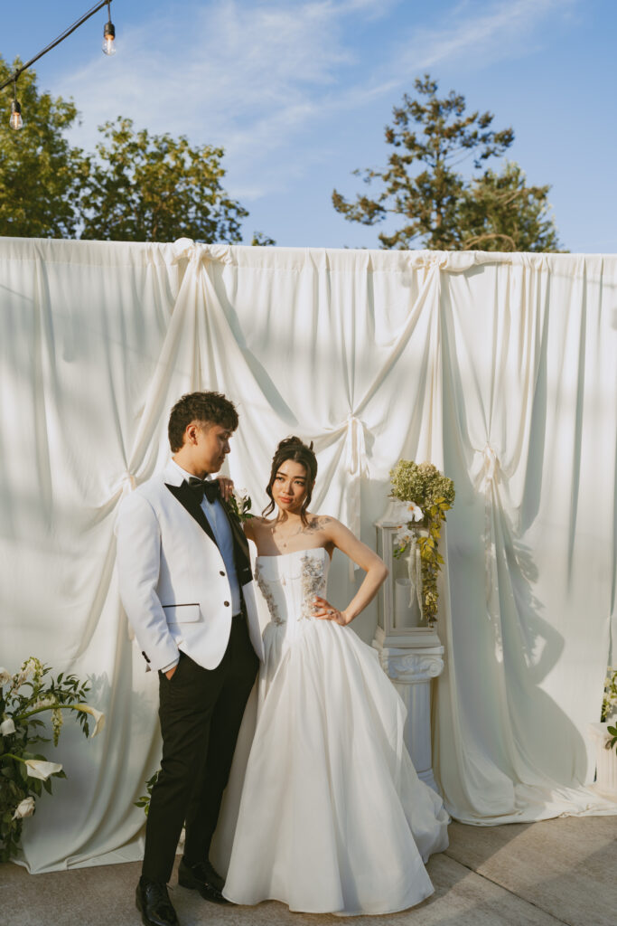 Bride and groom pose together at their micro wedding at aurora colony vineyards