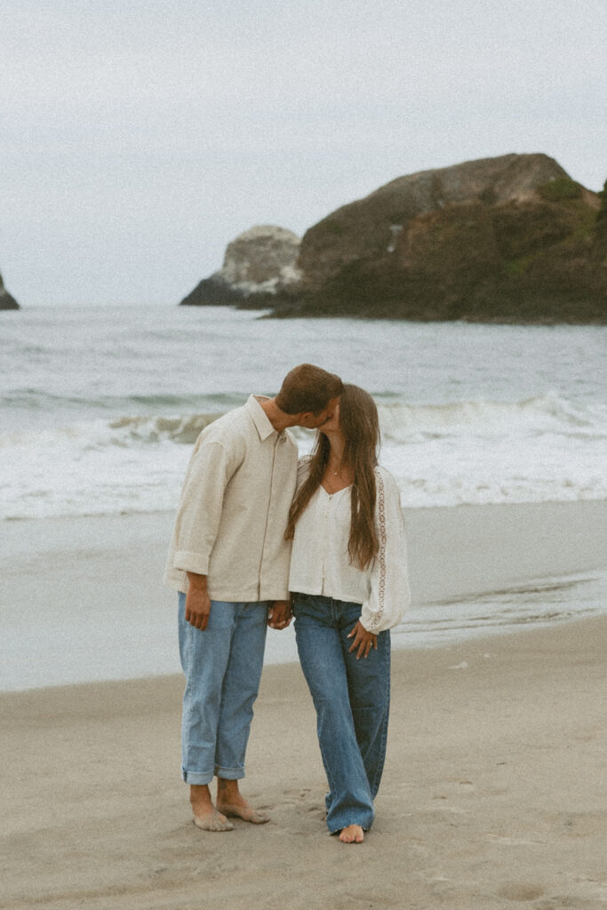 Jentrie and Brayden kissing for their romantic engagement shoot