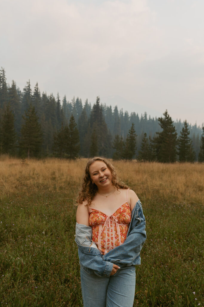 Lady smiling in greenery field