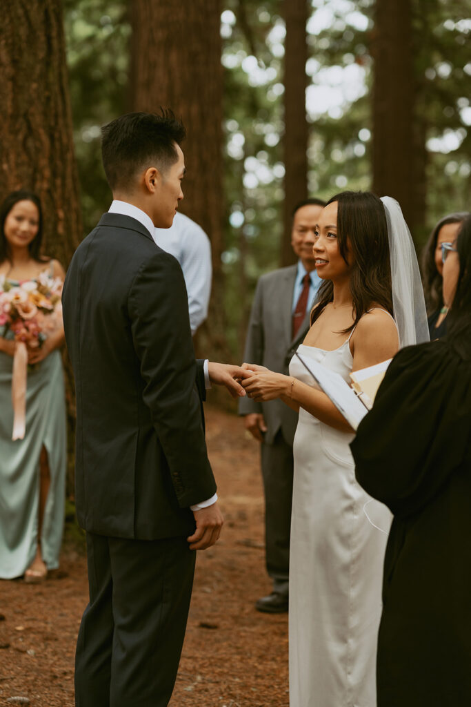 Couple holding hands during vows at Portland Oregon elopement