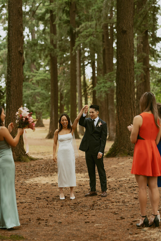 Bride and groom celebrating outdoors Portland Oregon elopement