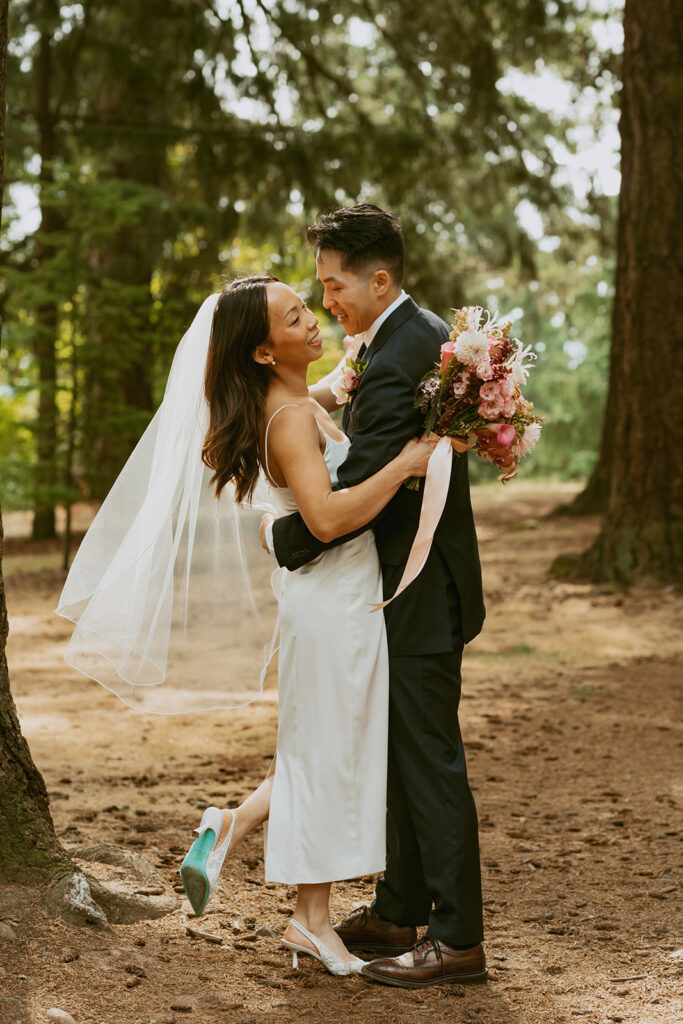 Couple embracing in forest Portland Oregon elopement