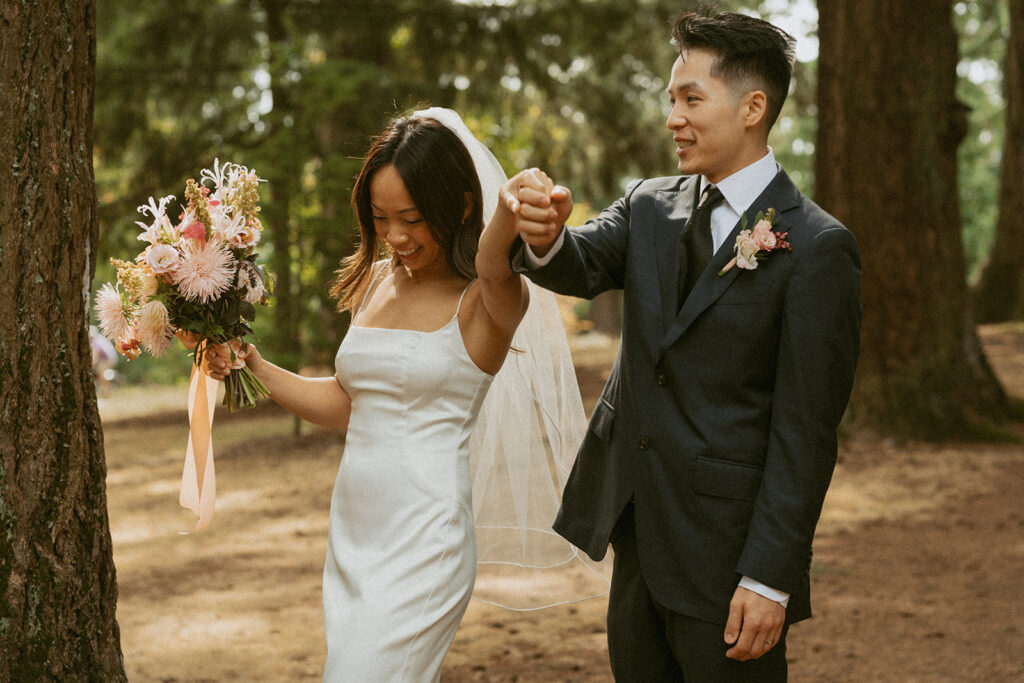 Bride and groom walking hand in hand Portland Oregon elopement