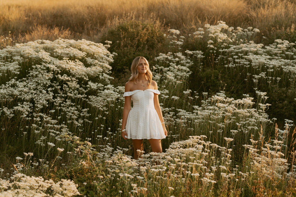Salem Oregon senior photography in wildflower field at sunset