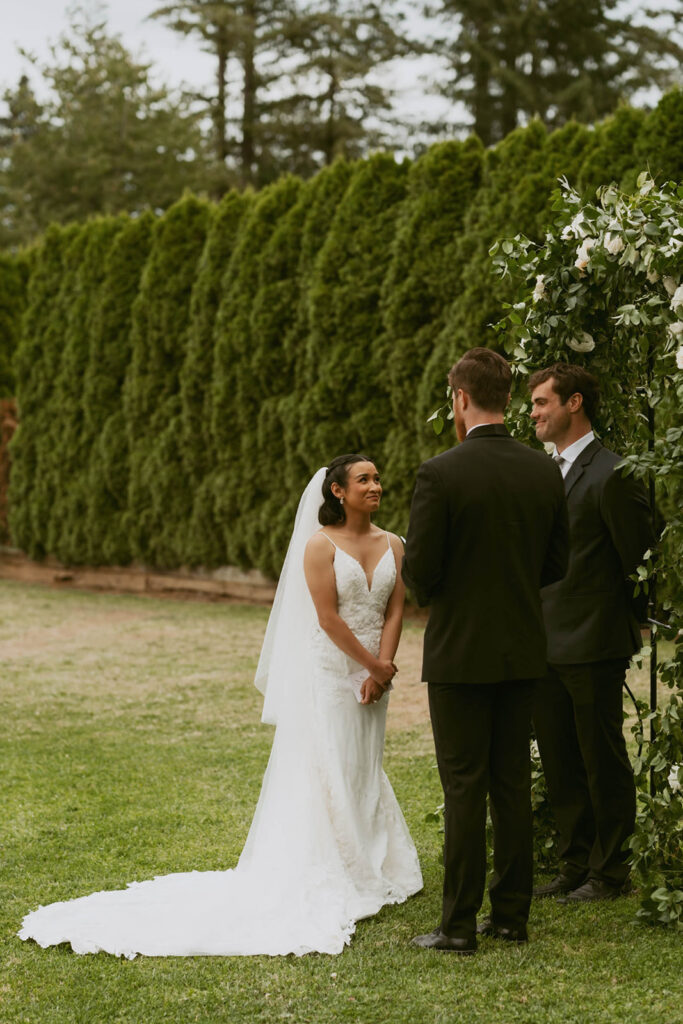 Groom twirling bride down wedding aisle