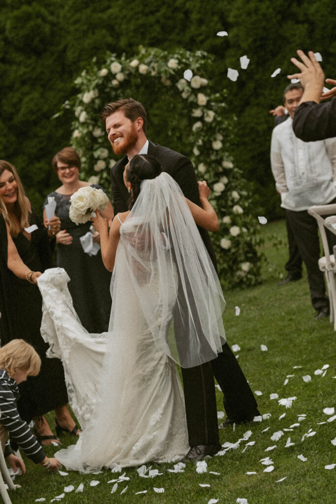 Couple celebrating with guests after ceremony