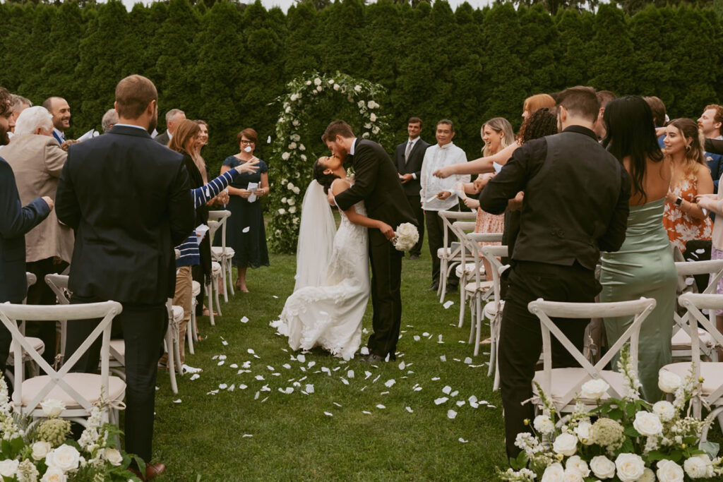 Guests seated for backyard wedding ceremony