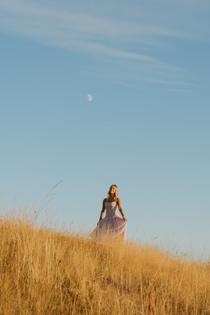 Senior photo session on a tall grass at Mary's peak by a Salem Senior photographer