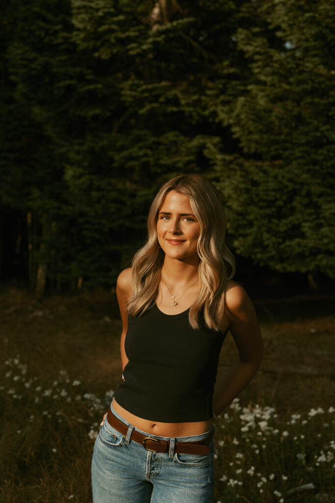 Close up photo of Gwyn during her Senior photo session at Mary's Peak wearing black tank top and jeans