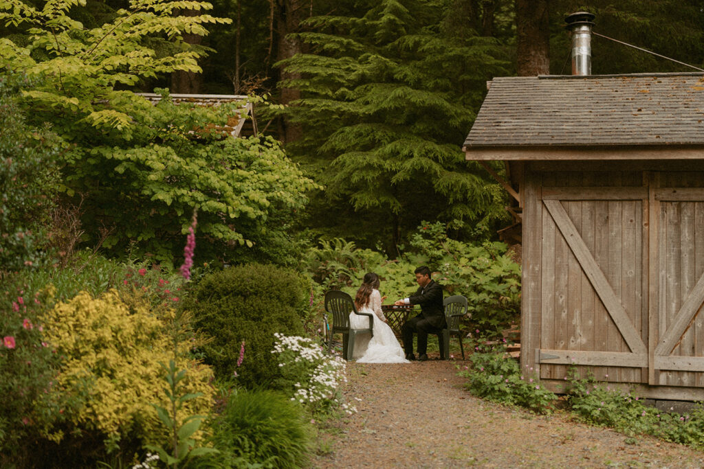 Couple sitting at a small table in a garden