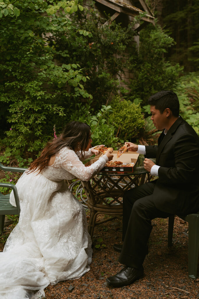 Bride and groom eating pizza outdoors