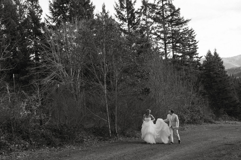 Black and white couple walking on forest road