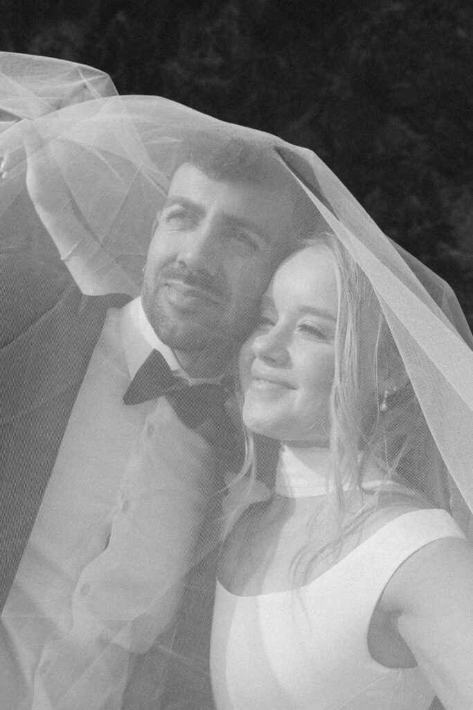 Black and white portrait beneath a veil