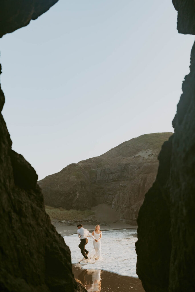 Couple holding hands on the beach