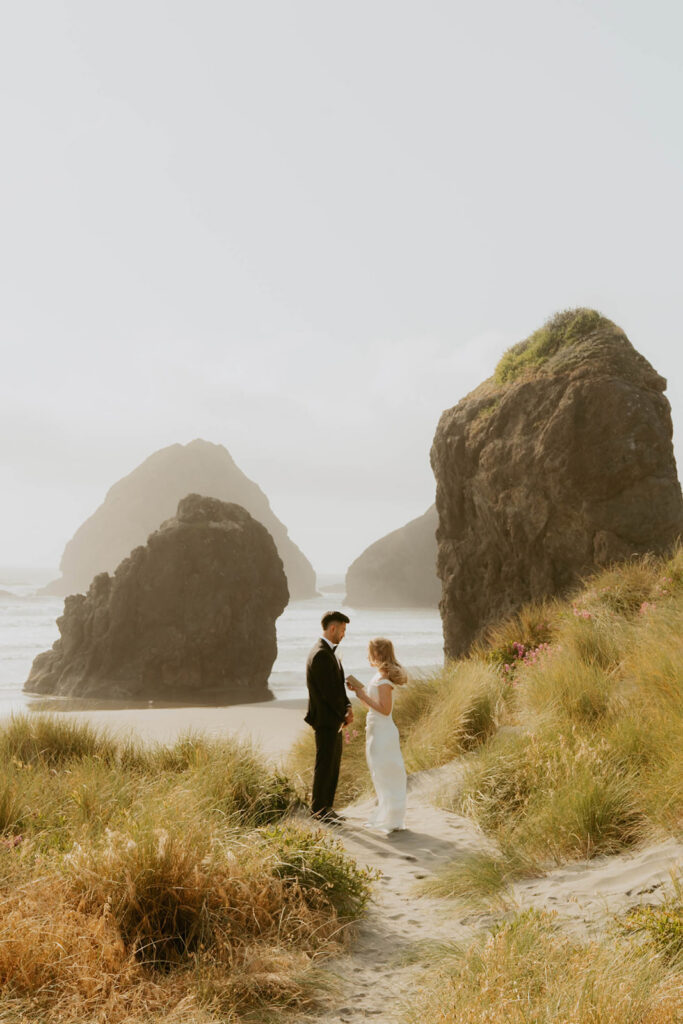 Couple standing together overlooking the beach