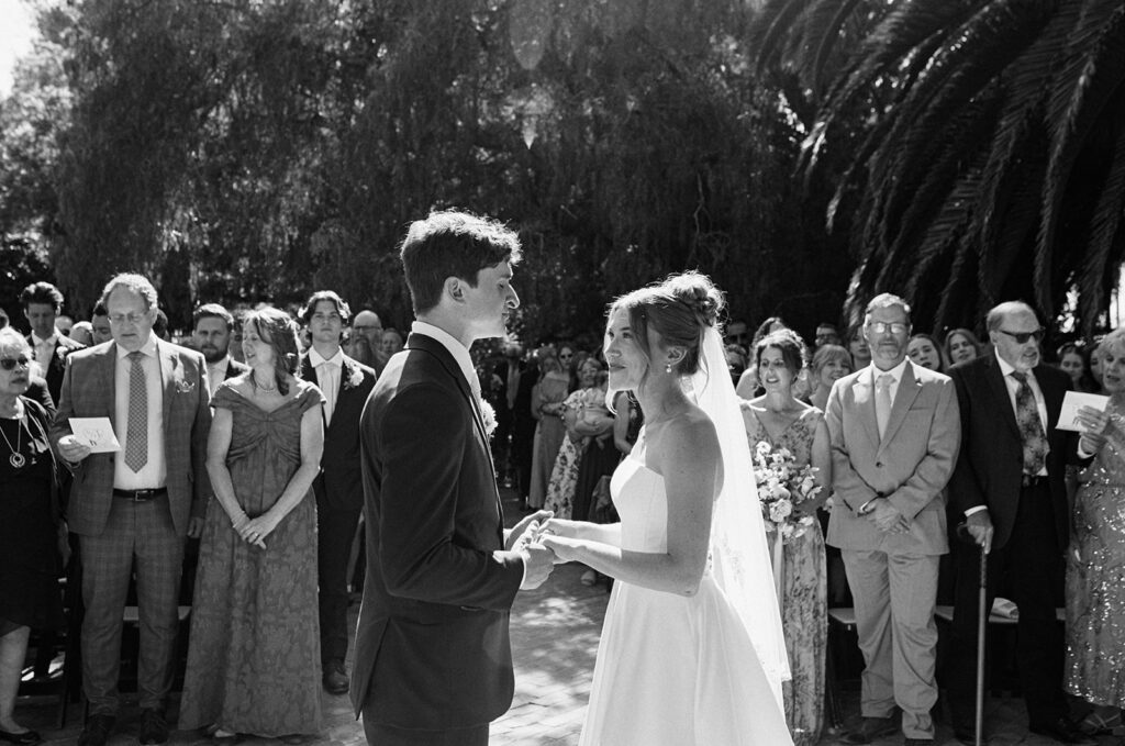 Black and white photo of couple during the ceremony