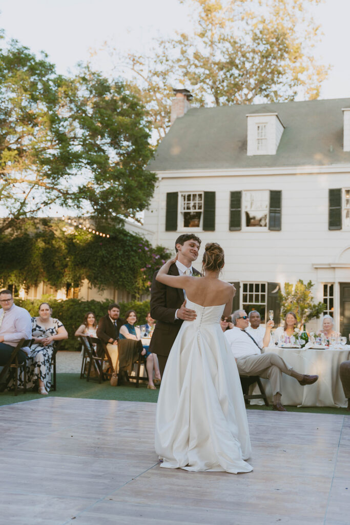 Couple dancing at an outdoor reception